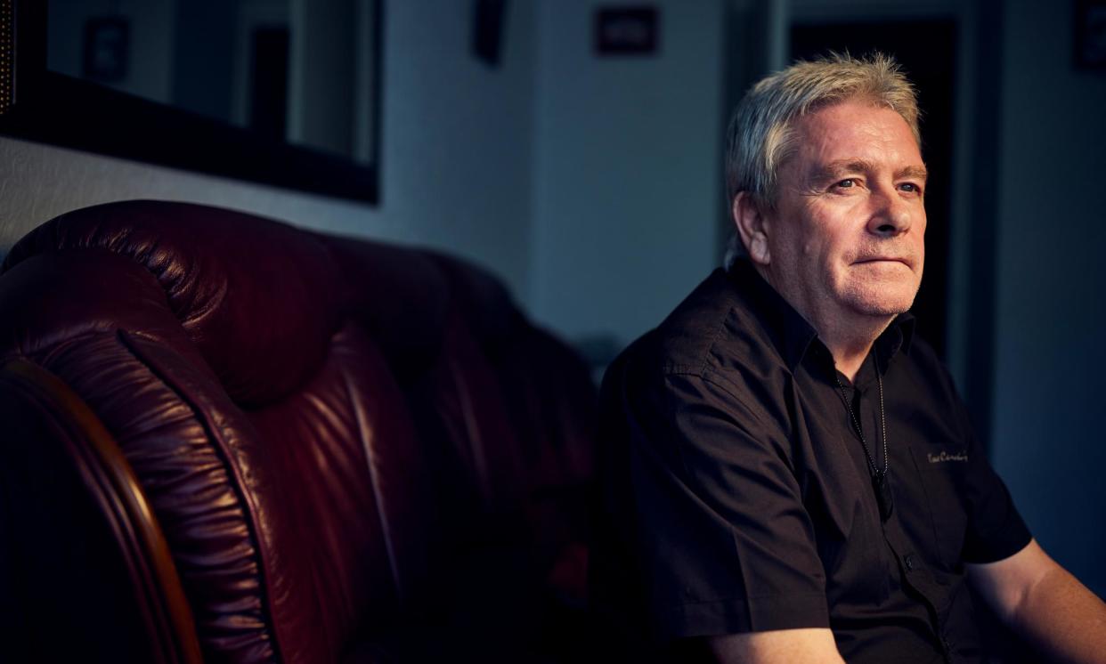 <span>George Henderson, a carer for his learning disabled son, had to pay back £20,000. </span><span>Photograph: Christopher Thomond/The Guardian</span>