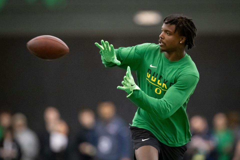 Oregon cornerback Khyree Jackson hauls in a pass during Oregon Pro Day Tuesday, March 12, 2024 at the Moshofsky Center in Eugene, Ore.