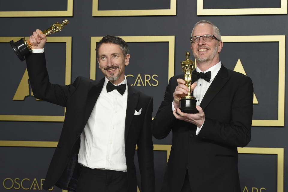 Stuart Wilson, left, and Mark Taylor, winners of the award for best sound mixing for "1917", pose in the press room at the Oscars on Sunday, Feb. 9, 2020, at the Dolby Theatre in Los Angeles. (Photo by Jordan Strauss/Invision/AP)