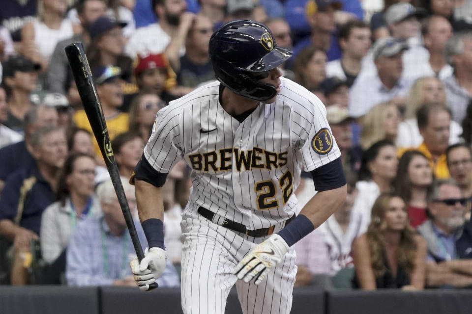 Milwaukee Brewers' Christian Yelich singles against the Atlanta Braves during the second inning in Game 2 of baseball's National League Divisional Series Saturday, Oct. 9, 2021, in Milwaukee. (AP Photo/Morry Gash)