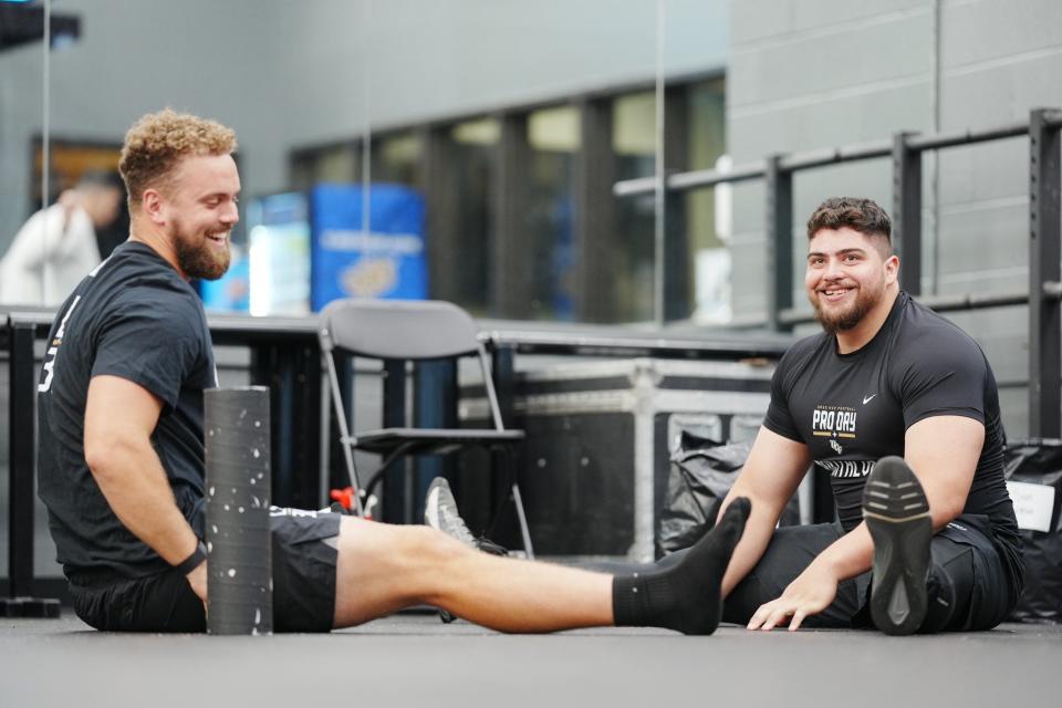 Long snapper Alex Ward, left, and defensive lineman Anthony Montalvo were among the nine UCF athletes to work out in front of NFL scouts at the school's pro day.