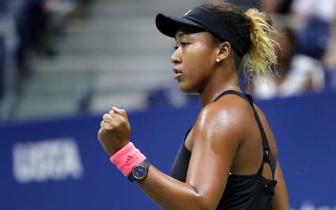 Naomi Osaka, of Japan, reacts after holding serve against Serena Williams during the women's final of the U.S. Open tennis tournament, Saturday, Sept. 8, 2018, in New York - Credit: AP