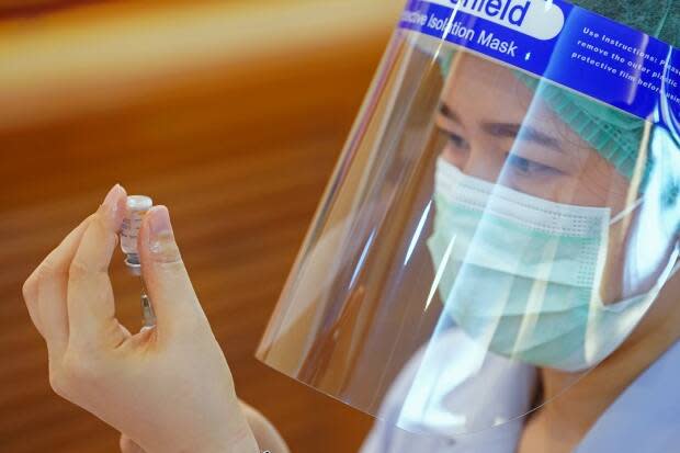 A health worker prepares to administer the Sinovac COVID-19 vaccine in Thailand in February. (Athit Perawongmetha/Reuters - image credit)