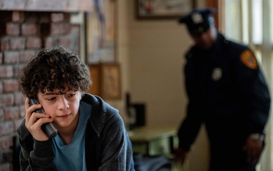 Henry (Noah Jupe) tried to cover for his father Jonathan (Hugh Grant)  - Niko Tavernise