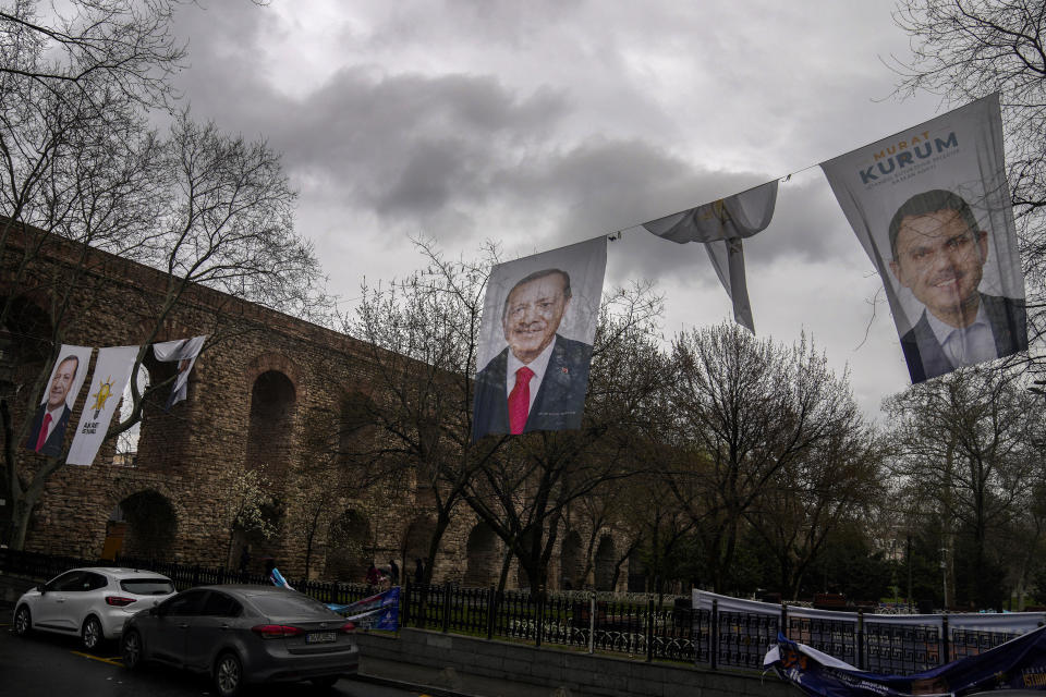 Turkish President and leader of the Justice and Development Party, or AKP, Recep Tayyip Erdogan, left, and party candidate for Istanbul Murat Kurum campaign banners hung ahead of nationwide municipality elections, in Istanbul, Turkey, Monday, March 25, 2024. With local elections across Turkey days away, legal experts are coaching thousands of volunteer election monitors on the rules they'll need to watch for fraud and ensure a fair vote. (AP Photo/Khalil Hamra)