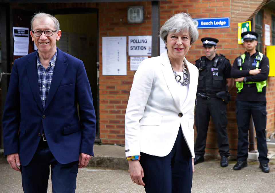 <p>Britain’s Prime Minister Theresa May leaves with her husband Philip after voting in the general election at polling station in Maidenhead, England, Thursday, June 8, 2017. (Photo: Alastair Grant/AP) </p>