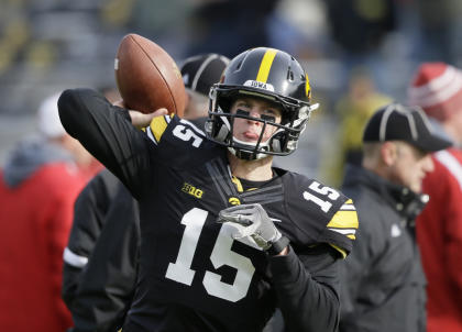 FILE - In this Nov. 28, 2014, file photo, Iowa quarterback Jake Rudock warms up before an NCAA college football game against Nebraska in Iowa City, Iowa. Iowa coach Kirk Ferentz is expected to clarify that status of quarterback Jake Rudock, a two-year starter relegated to the bench for spring ball. (AP Photo/Charlie Neibergall, File)