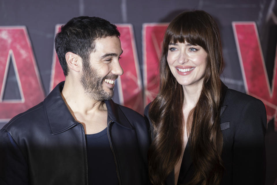 Tahar Rahim, left and Dakota Johnson pose for photographers during a photo call to promote the film 'Madame Web' in London, Wednesday, Jan. 31, 2024. (Photo by Vianney Le Caer/Invision/AP)