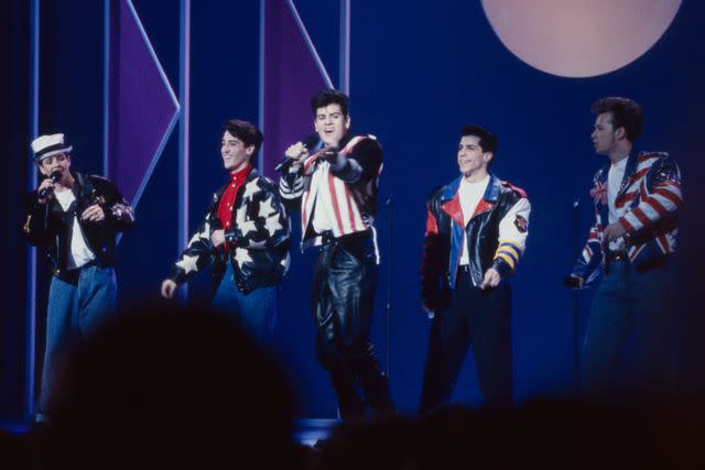 <p>Craig Sjodin /Disney/Getty Images</p> New Kids on the Block performing on the American Music Awards, Shrine Auditorium on Jan. 22, 1990