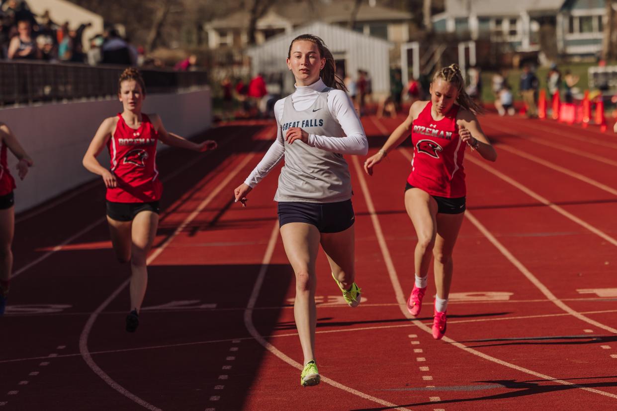 Great Falls High's Abby MacDonald finishes first in a 100-meter race against Bozeman High on April 9. MacDonald is one of the top sprinters in the state despite coming off of an ACL tear last year.