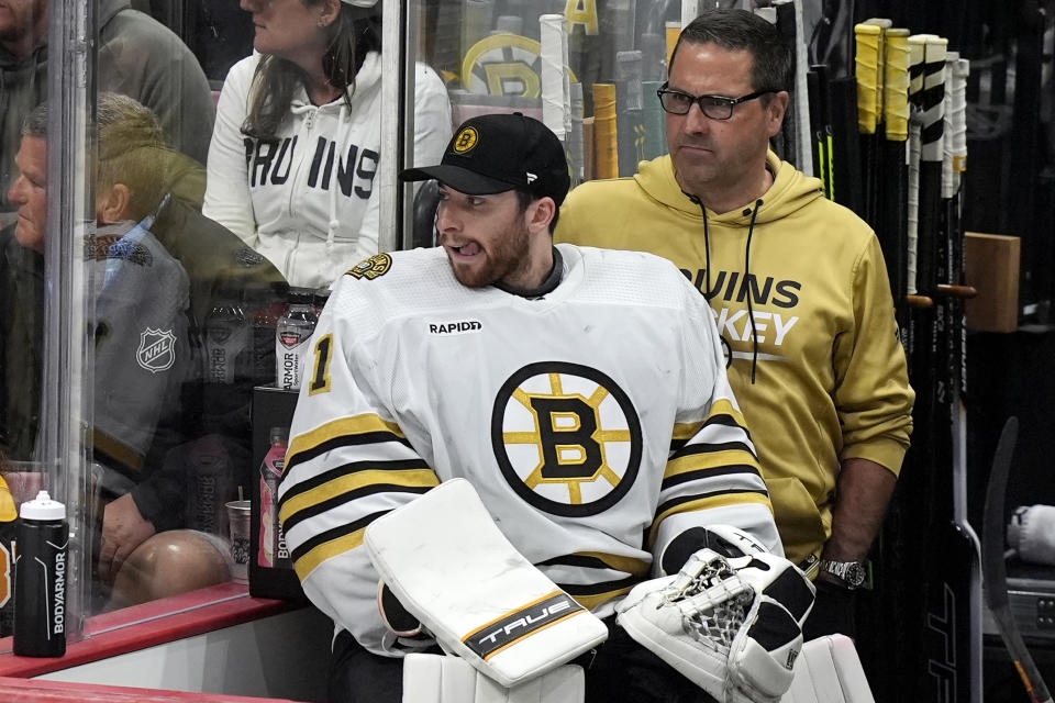 Boston Bruins goaltender Jeremy Swayman watches from the bench during the third period of Game 2 against the Florida Panthers of a second-round series of the NHL hockey Stanley Cup playoffs Wednesday, May 8, 2024, in Sunrise, Fla. (AP Photo/Lynne Sladky)