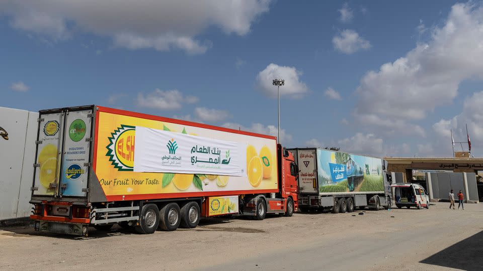 Aid convoy trucks wait at the Rafah Crossing for clearance to enter Gaza on October 19, 2023 in North Sinai, Egypt.  - Mahmoud Khaled/Getty Images