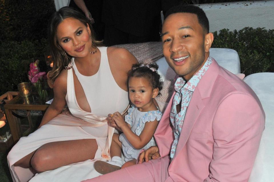 2018: Chrissy Teigen, Luna Simone Stephens and John Legend attend John Legend's launch of his new rose wine brand, LVE, during an intimate Airbnb Concert in 2018 (Getty Images)