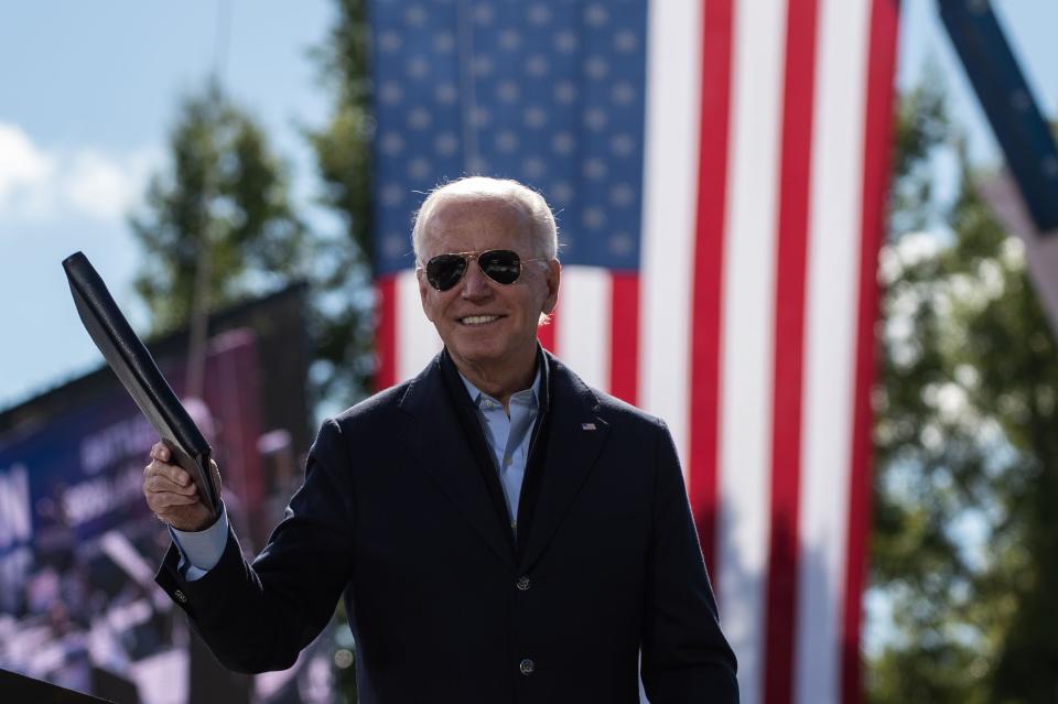 Democratic presidential nominee Joe Biden, the former vice president, smiles as he acknowledges the crowd at the end of his speech at the Riverside High School in Durham, North Carolina during a campaign stop on Oct. 18, 2020.