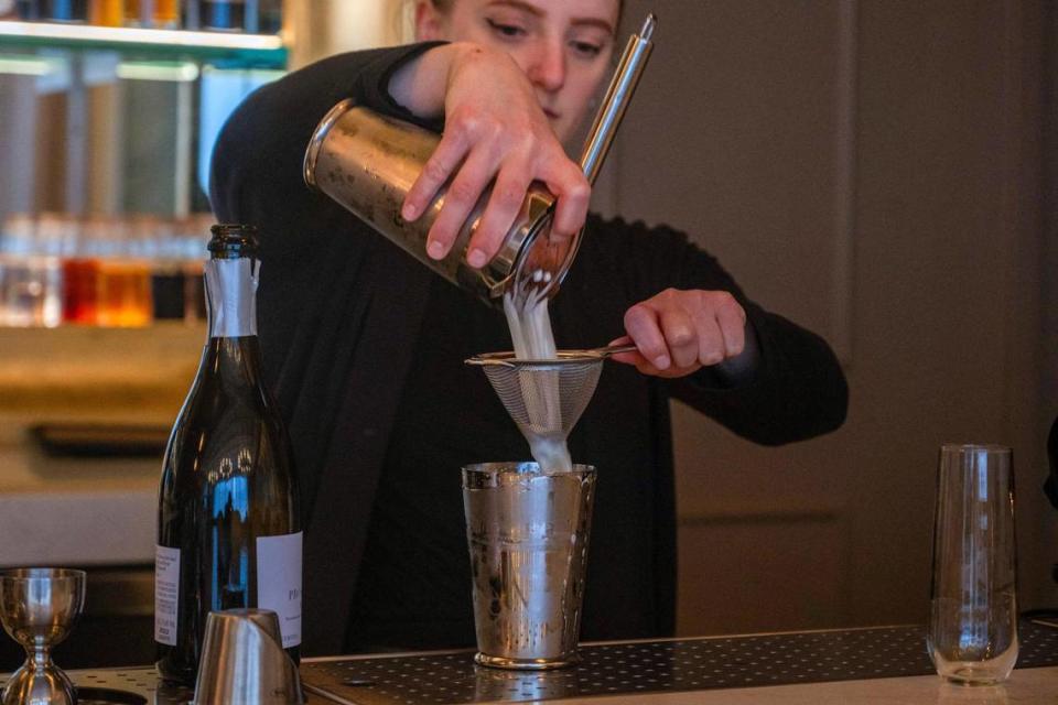 Bartender Abby Lee prepares a frizzante cocktail at Bar Medici, a Renaissance-style bar and restaurant.