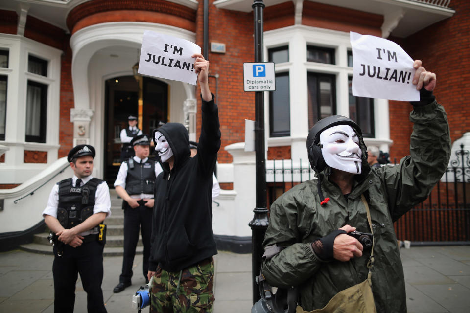 Protesters gather outside the Ecuadorian Embassy, where Julian Assange, founder of Wikileaks is staying on August 16, 2012 in London, England. Mr Assange has been living inside Ecuador's London embassy since June 19, 2012 after requesting political asylum whilst facing extradition to Sweden to face allegations of sexual assault. (Photo by Dan Kitwood/Getty Images)