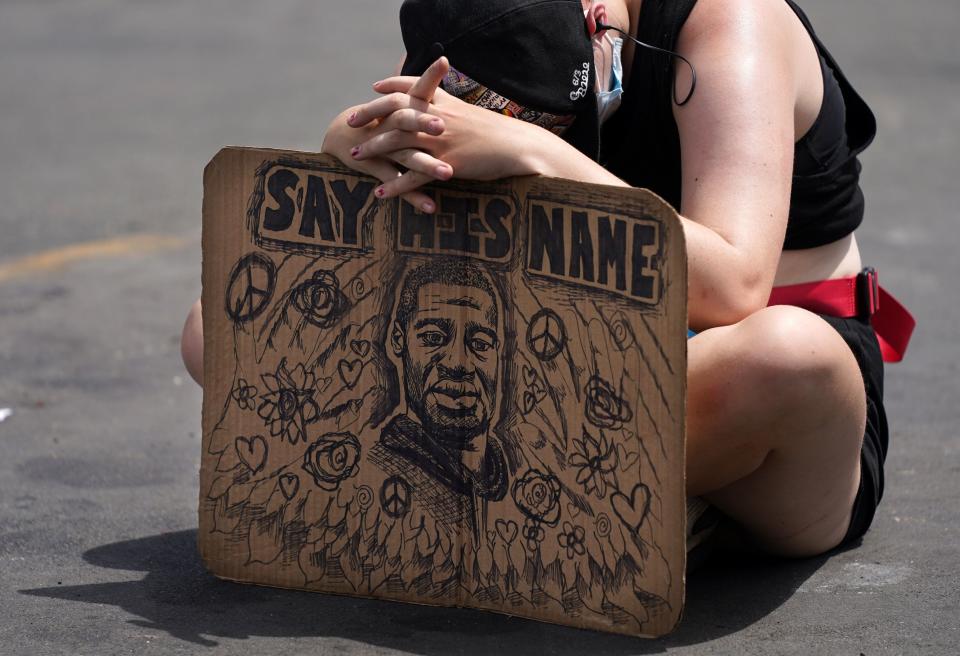 People gathered in the middle of the street at the site of George Floyd's death to listen to audio from Floyd's memorial service on June 4, 2020, in south Minneapolis. (Photo: Star Tribune via Getty Images via Getty Images)