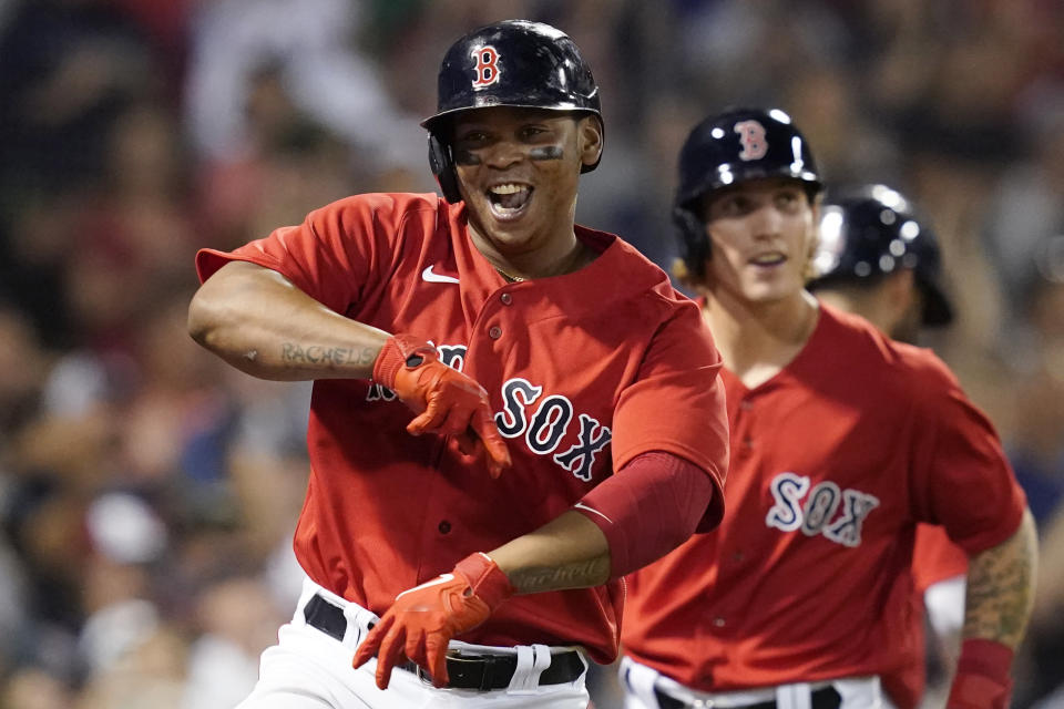 Boston Red Sox's Rafael Devers celebrates his two-run home run against the New York Yankees during the fifth inning of a baseball game at Fenway Park, Friday, July 23, 2021, in Boston. (AP Photo/Elise Amendola)