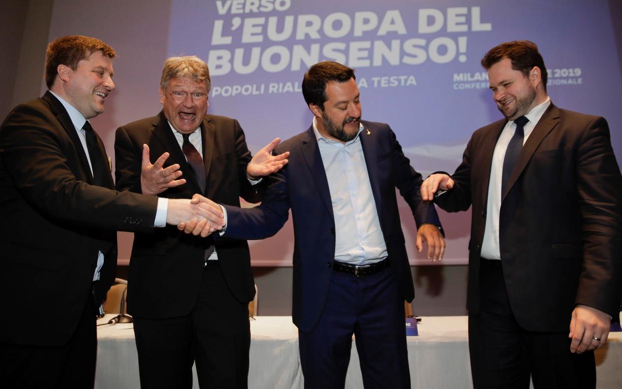 From left, Olli Kotro, leader of The Finns Party, Jorg Meuthen, leader of Alternative For Germany party, Matteo Salvini, Italian deputy PM and leader of the League party, and Anders Vistisen, leader of the Danish People's Party, join hands at the press conference in Milan  - AP