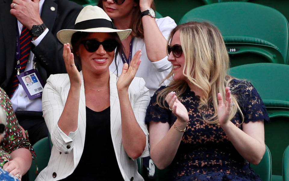 Meghan Markle claps as she sits next to Lindsay Jill Roth at the 2019 Wimbledon championships. (Reuters)