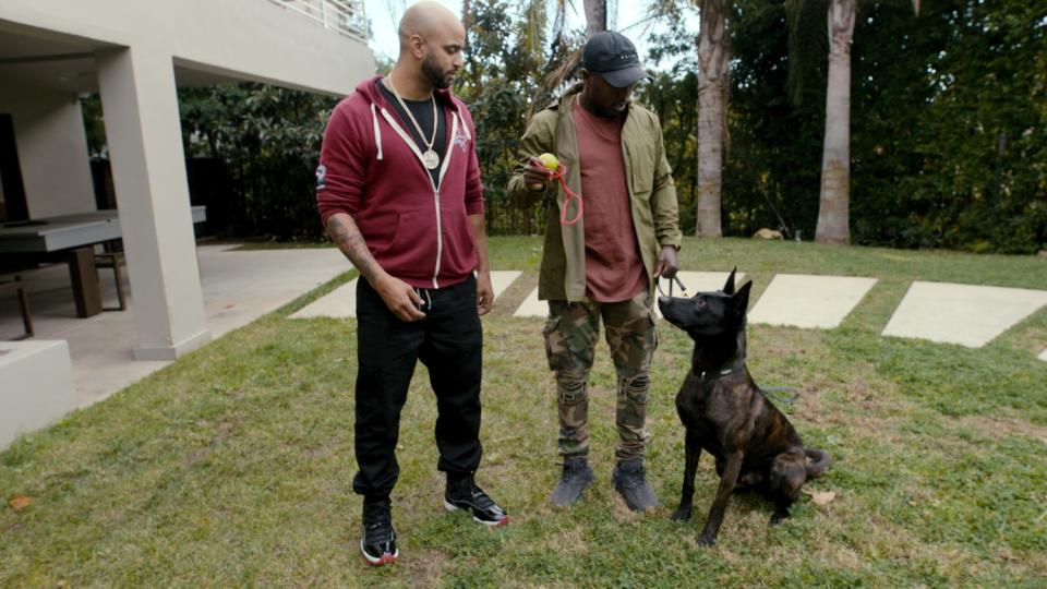 Dog trainer Jas Leverette and his client Andre Berto in a scene from 'Canine Intervention.'