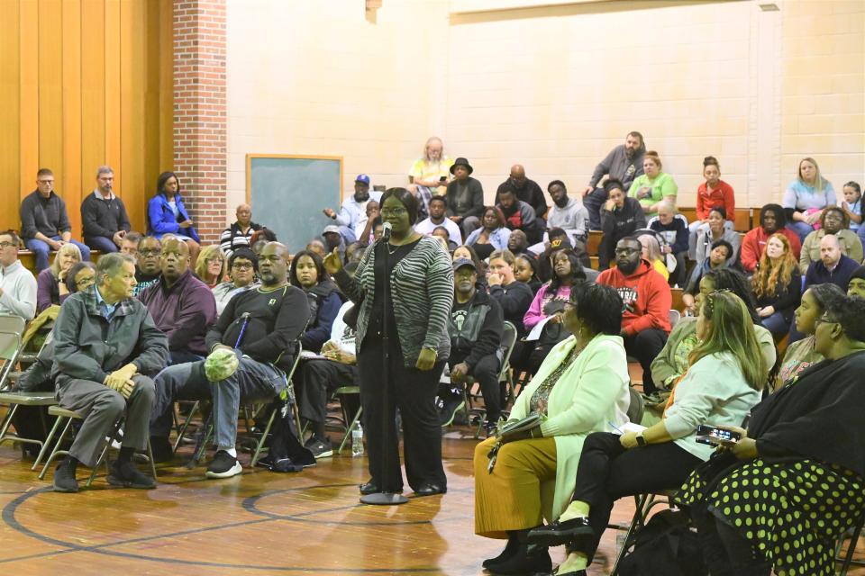 Tesha Horsey's 18-year-old son, Corey Mumford, was shot and killed in Laurel April 14. Here, she speaks at a meeting at the former Paul Laurence Dunbar Elementary School on Nov. 12, 2023.