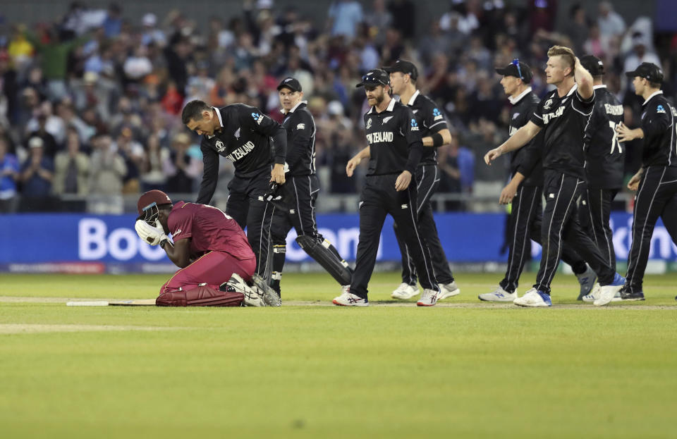 New Zealand's Ross Taylor consoles West Indies' Carlos Brathwaite at the end of the Cricket World Cup match between New Zealand and West Indies at Old Trafford in Manchester, England, Saturday, June 22, 2019. Brathwaite blazed 101 from 82 balls as the last three West Indies wickets combined for 122 runs and got within one shot of a spectacular comeback victory. He went for broke, trying to hit the last ball of the 49th over from Jimmy Neesham for six and was caught on the long-on boundary by Trent Boult. (AP Photo/Jon Super)