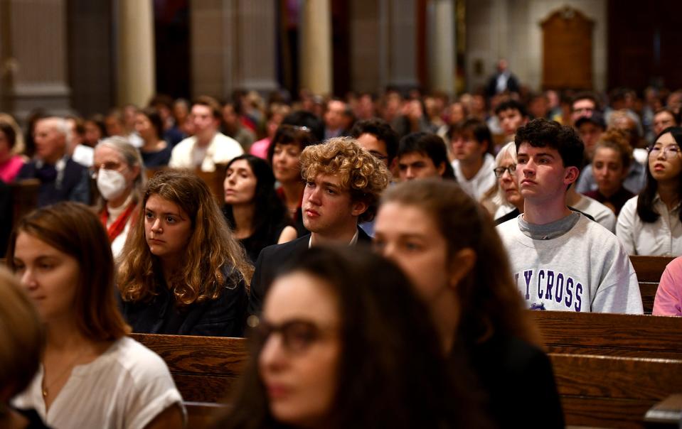 Faculty, students and guests listen as Russian journalist Dmitry Muratov speaks at College of the Holy Cross' St. Joseph Memorial Chapel.