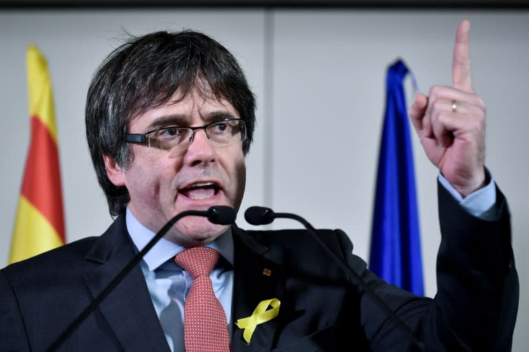 "We will not surrender to authoritarianism despite Madrid's threats," ousted Catalan leader Carles Puigdemont said