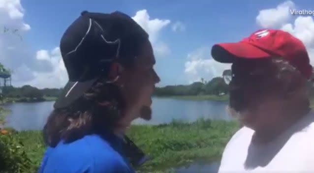 The conversation becomes heated after the activist throws the fish back into the lake. Photo: ViralHog