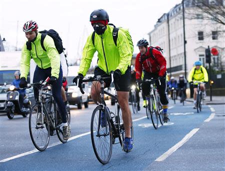 Cyclists commute along The Embankment during an underground strike in London February 5, 2014. REUTERS/Eddie Keogh