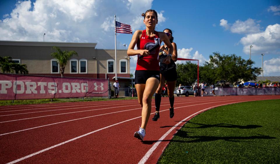 Ava Povich from Evangelical Christian School leads the 1600 meters during the Class 1A-District 12 track meet at ECS. She won.  