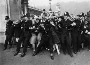 <p>Beatle Mania was strong outside the palace, as guards could barely hold back fans eager to get a good look at John, Paul, Ringo, and George. </p>