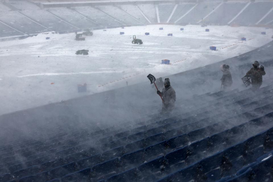 Orchard Park residents walked to the stadium Sunday to help pitch in with snow removal efforts.