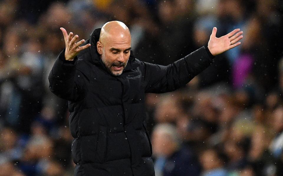 Manchester City's Spanish manager Pep Guardiola gestures on the touchline during the UEFA Champions League Quarter-final first leg football match between Manchester City and Atletico Madrid - OLI SCARFF/AFP via Getty Images)