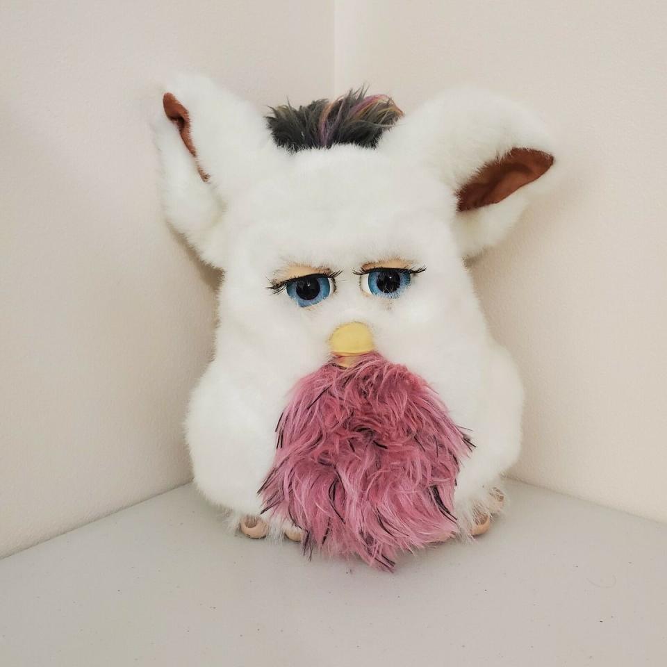 <p>The Furby hype was real in the '90s and early '00s despite the creepy vibe they give off. (Have you seen those eyes?!) The White Passionfruit fluffy friend <a href="https://www.ebay.com/itm/FURBY-2005-TIGER-ELECTRONICS-Talking-Toy-HASBRO-EMOTO-TRONIC-White-Passionfruit/114386830789?hash=item1aa1fc85c5:g:-zkAAOSwkgZdHNfE" rel="nofollow noopener" target="_blank" data-ylk="slk:is valued;elm:context_link;itc:0;sec:content-canvas" class="link ">is valued</a> at $850.</p>