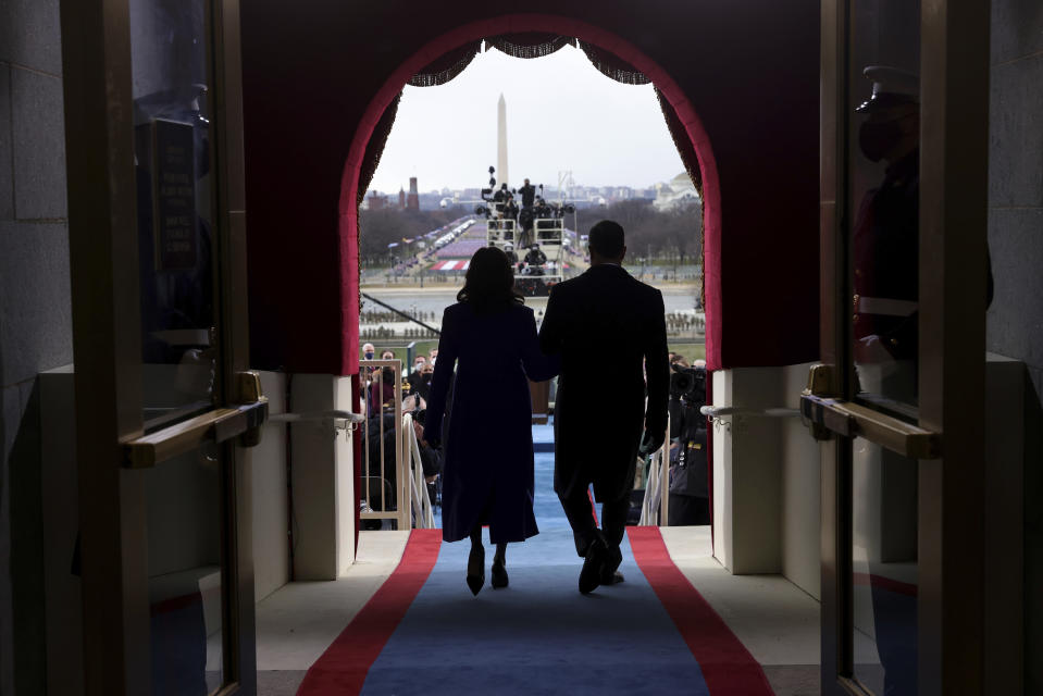 Vice President-elect Kamala Harris and her husband Doug Emhoff arrive for the 59th Presidential Inauguration at the U.S. Capitol in Washington, Wednesday, Jan. 20, 2021. (Win McNamee/Pool Photo via AP)