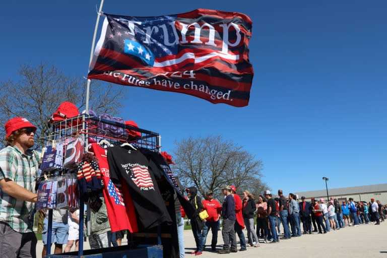 A vendor sells merchandise as supporters of former US president and 2024 White House candidate Donald Trump wait in line for Trump's campaign event in Waukesha, Wisconsin (Alex Wroblewski)