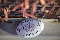 A decorated rock remembering the victims of the August 2019 mass shooting rests at a memorial site in El Paso, Texas, Wednesday, Feb. 8, 2023. Patrick Crusius, the defendant in the deaths of 23 people at an El Paso Walmart is expected to plead guilty during a re-arraignment hearing in federal court. (AP Photo/Andrés Leighton)