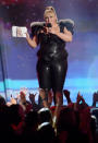 Now that's what you call power dressing. Rebel Wilson reveals what her cue cards say....