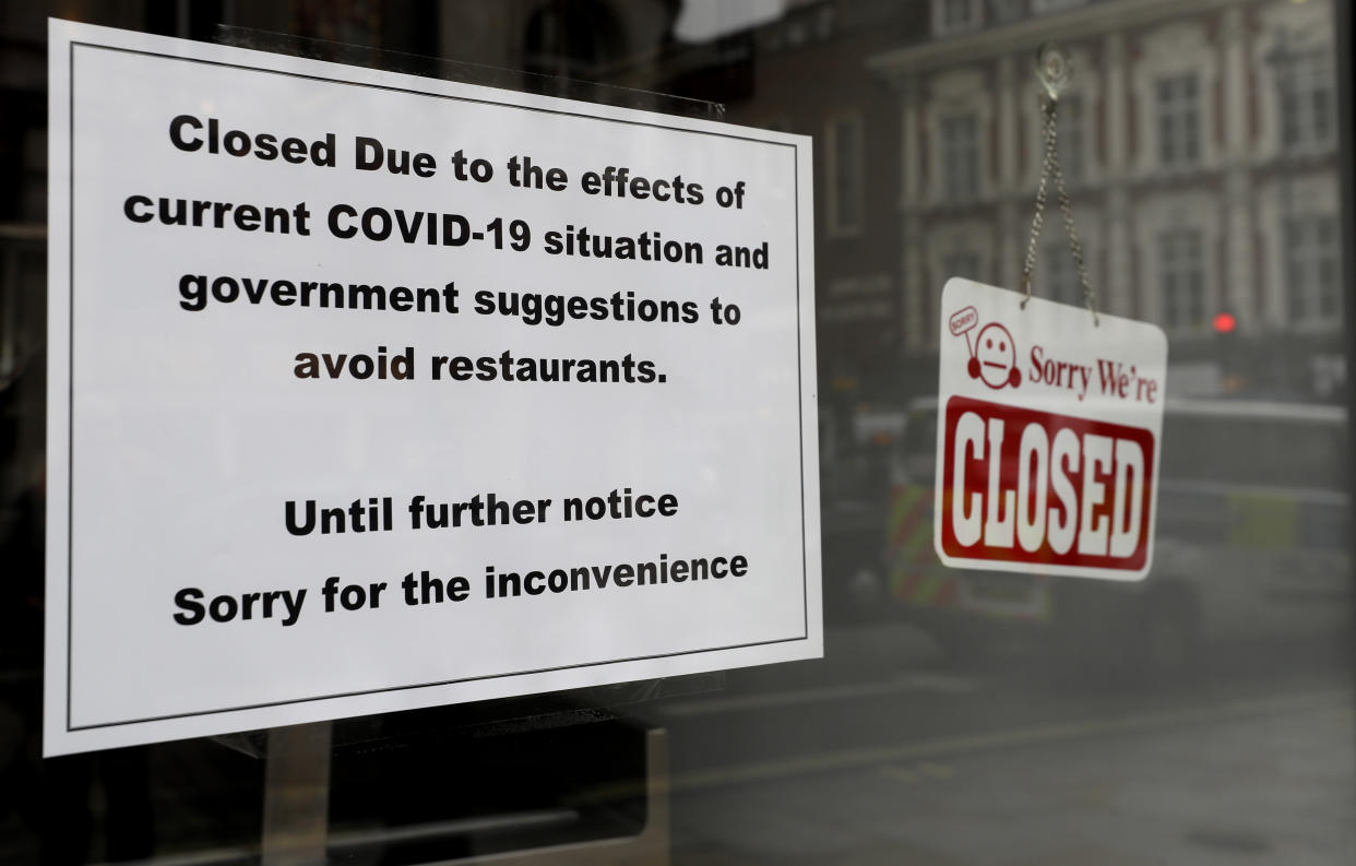 A sign on a closed restaurant in London, Tuesday, March 17, 2020. For most people, the new coronavirus causes only mild or moderate symptoms, such as fever and cough. For some, especially older adults and people with existing health problems, it can cause more severe illness, including pneumonia. (AP Photo/Kirsty Wigglesworth)