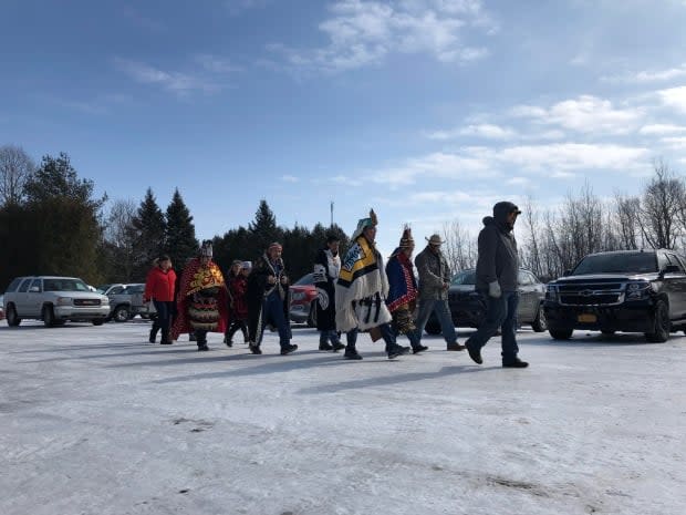 A delegation of Wet’suwet’en hereditary chiefs walks toward the Longhouse to meet with members of the Kahnawake branch of the Mohawk Nation in February 2020.