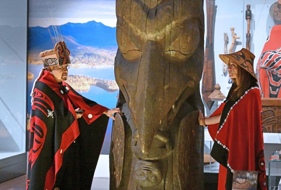 Sim’oogit Ni’isjoohl (Chief Earl Stephens) and Noxs Ts’aawit (Dr. Amy Parent) stand with the Ni'isjoohl memorial pole in the National Museum of Scotland on August 22, 2022.