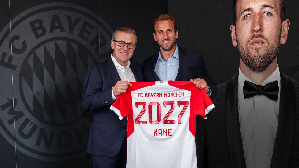 Bayern CEO Jan-Christian Dressen and Harry Kane hold up the German club's shirt with the England captain's name on the back during the unveiling of his signing on August 11, 2023 in Munich, Germany. - S. Mellar/FC Bayern/Getty Images