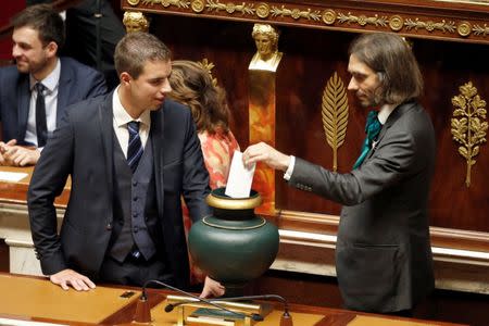 Newly elected member of parliament Cedric Villani of the Institute Henri Poincare, who was awarded with the Fields medal 2010, of "La Republique en Marche" (Republic on the Move or LREM) political party casts his vote for the election of the speaker during the opening session of the French National Assembly in Paris, France, June 27, 2017. REUTERS/Charles Platiau