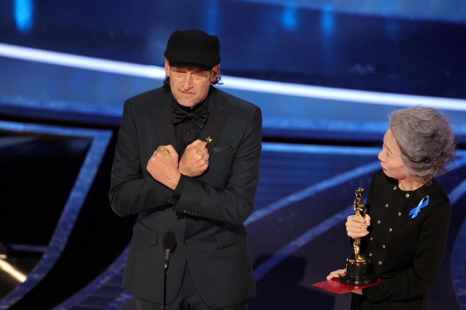 Troy Kotsur accepts the Academy Award for Best Actor in a Supporting Role for his performance in 