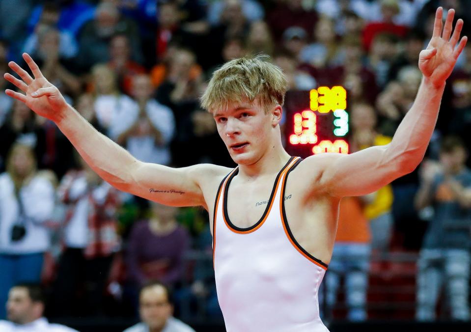 Kaukauna's Greyson Clark celebrates after defeating Germantown's Riese Thornberry in the Division 1 138-pound championship match during the WIAA individual state wrestling tournament Feb. 25 in Madison.