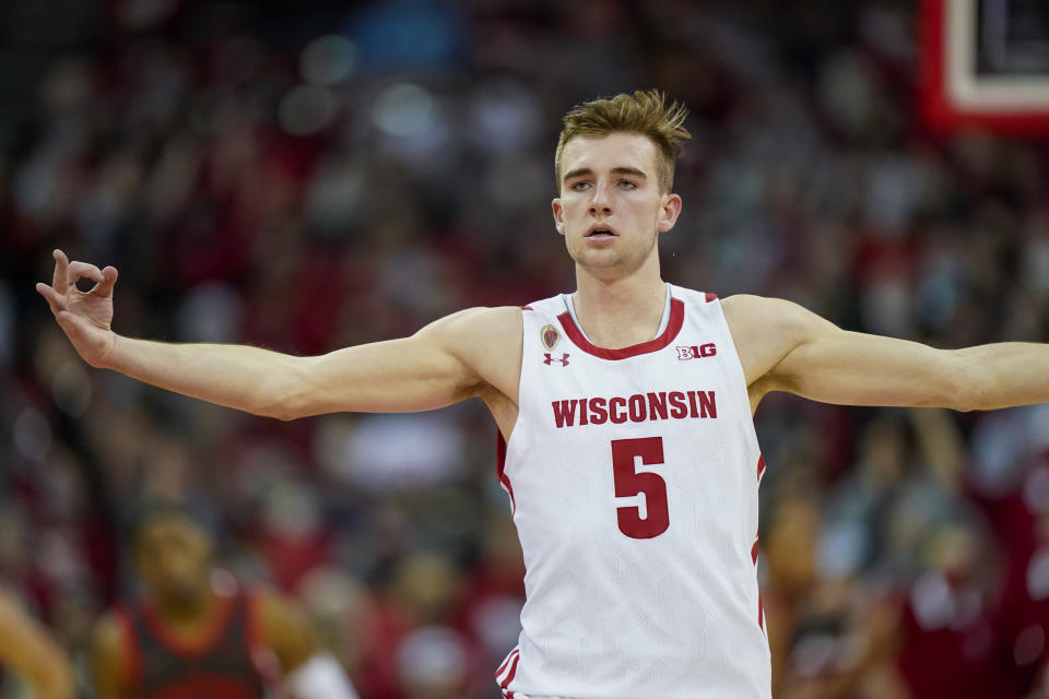 Wisconsin's Tyler Wahl (5) signals after hitting a 3-point basket against Ohio State during the first half of an NCAA college basketball game Thursday, Jan. 13, 2022, in Madison, Wis. (AP Photo/Andy Manis)