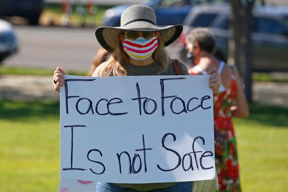 Kris Reddout, a fifth grade teacher, attends a Utah Safe Schools Mask-In urging the governor's leadership in school reopening during a rally Thursday, July 23, 2020, in Salt Lake City.