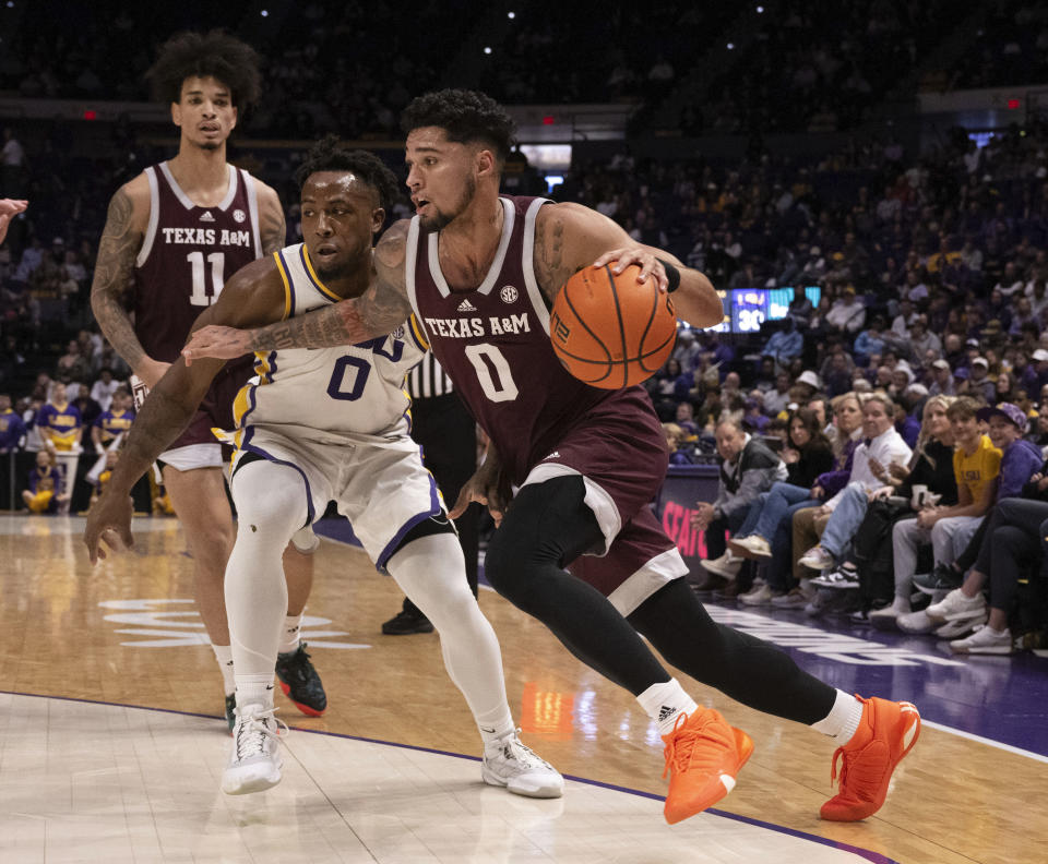 Texas A&M guard Jace Carter (0) drives the ball around LSU guard Trae Hannibal (0) during an NCAA college basketball game, Saturday, Jan. 20, 2024, at the LSU PMAC in Baton Rouge, La. (Hilary Scheinuk/The Advocate via AP)